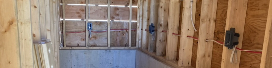 A picture of a home renovation with rough wiring exposed